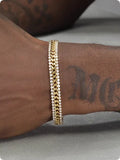 Gold tennis bracelet with stone detailing on titanium steel band for men and women
