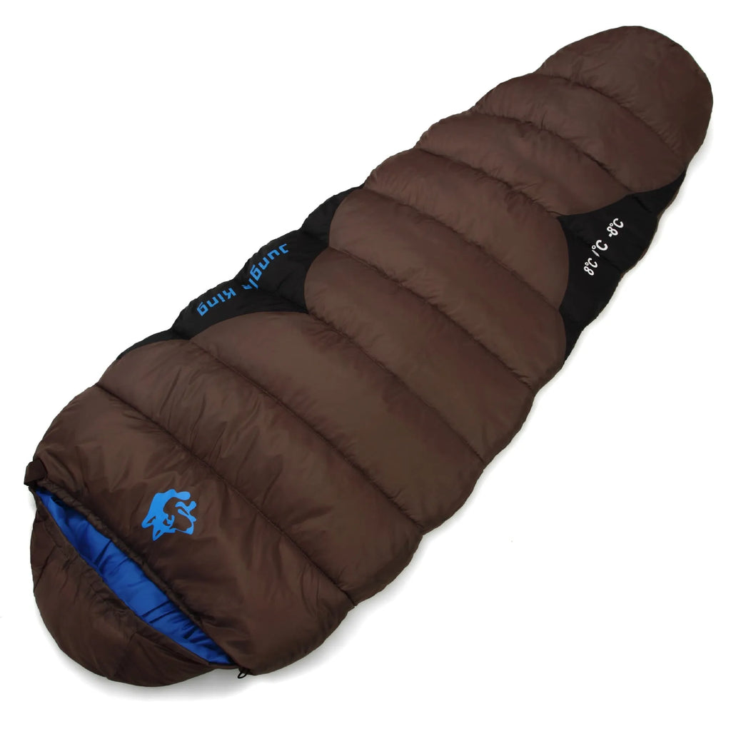 Outdoor cotton sleeping bag in Army Green, shown beside its grey compression storage sack.