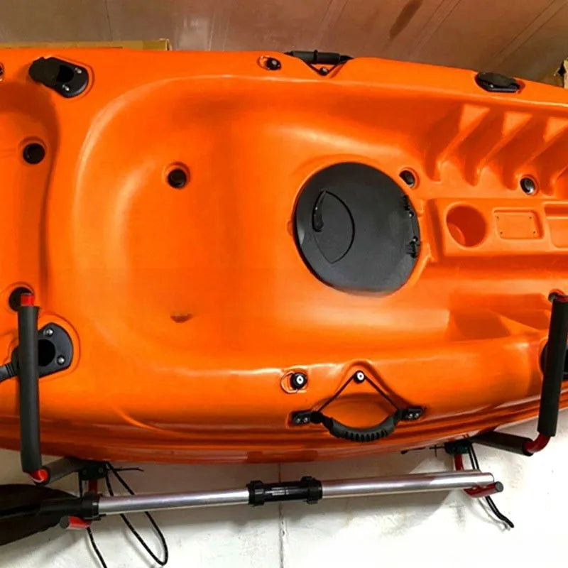 Carbon steel kayak wall hanger with foam-lined hooks mounted on a wall, showing dimensions of 43 by 38 cm.