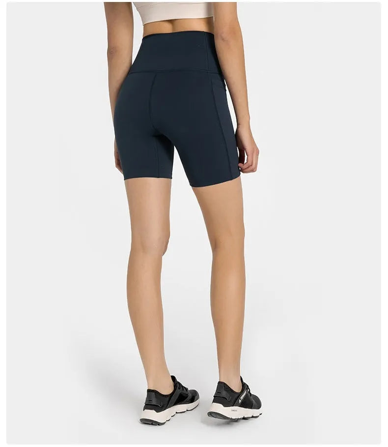 Women's solid colour sports shorts in a cotton blend fabric with super stretch, shown in a mid-length fit.
