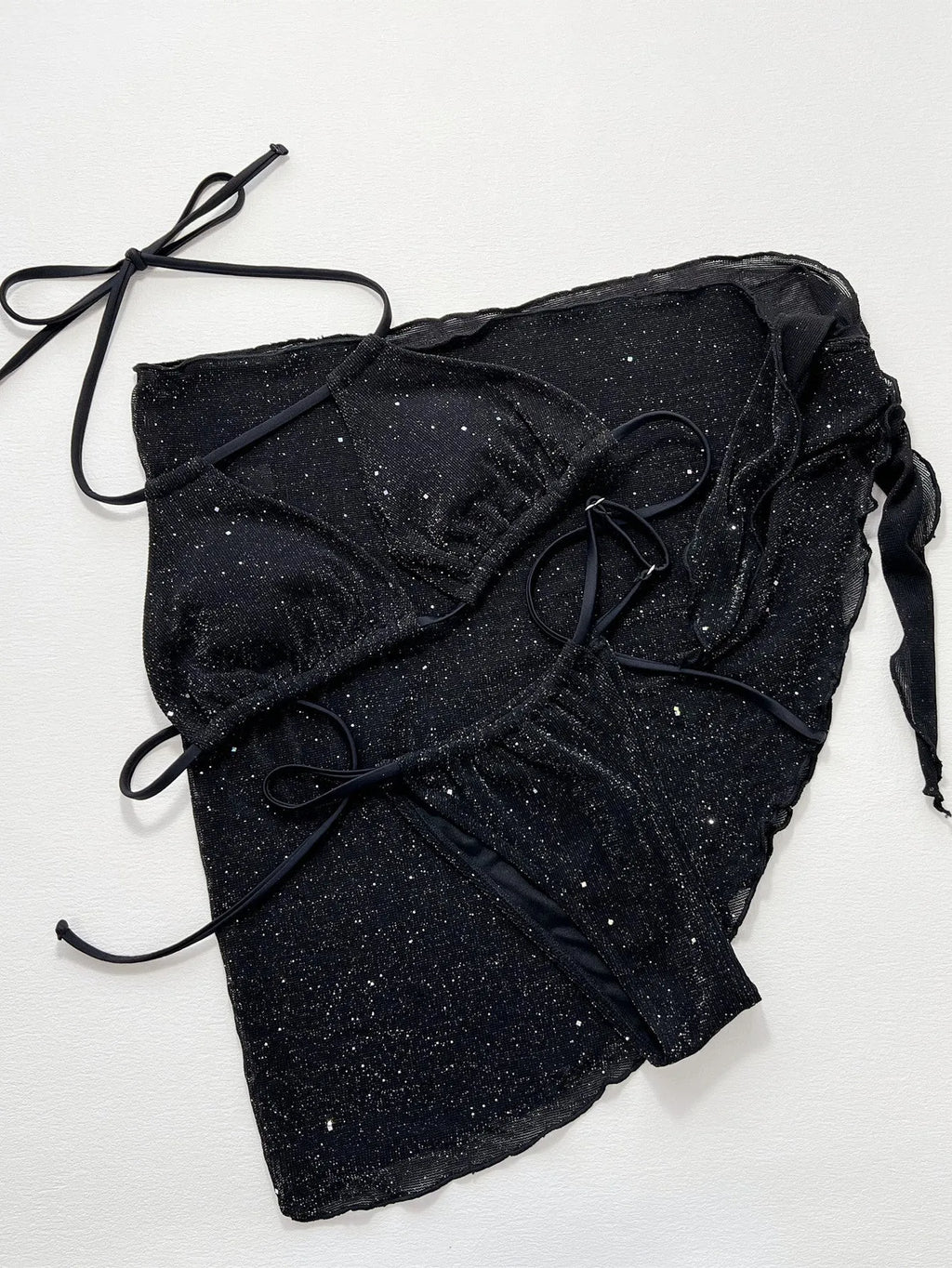 Black three-piece polyester bikini swimsuit set with top and shorts on mannequin