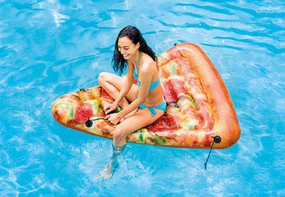 Pizza slice shaped inflatable surfboard recliner floating on water with colourful graphic design