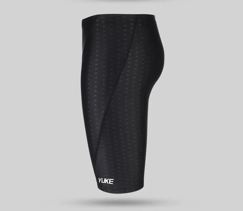 Men's black five-piece swimming set showing trunks, goggles, cap, ear plugs, nose clip, and storage bag