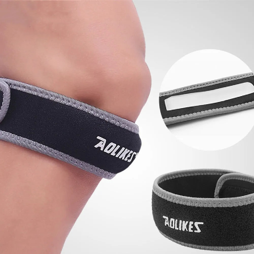 Black and grey patella retinaculum knee support for adult sports like running and football.
