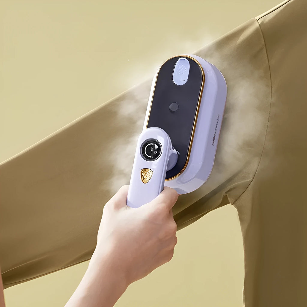 Light purple foldable portable travel iron with a ceramic soleplate and UK plug on a white background.