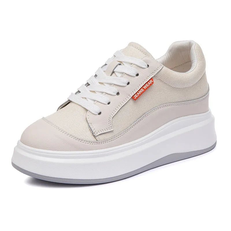 Women's beige leather board shoes with thick soles for height increase on neutral background