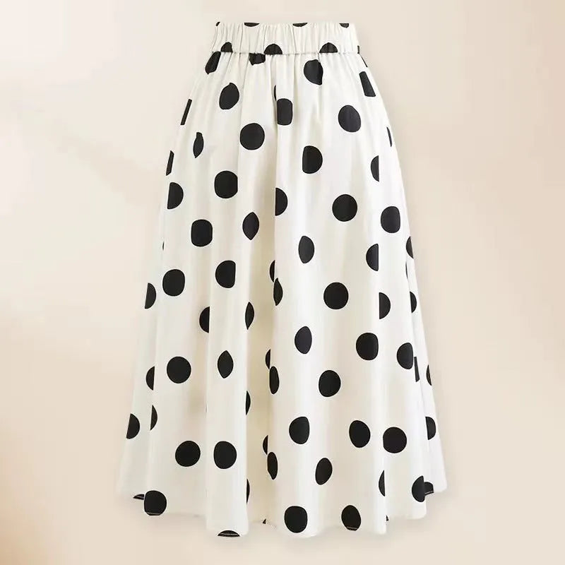 Women's black one-piece swimsuit with white round skirt and bow decoration on front