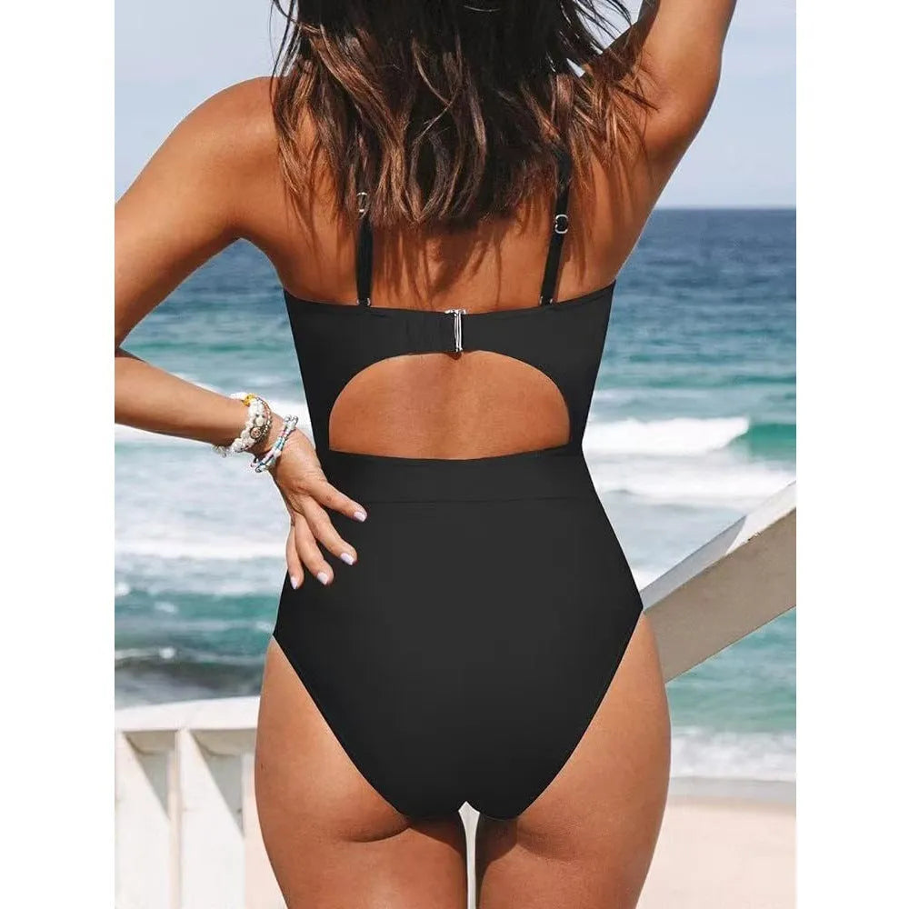 Women's solid colour backless one-piece swimsuit in black, red, or blue.