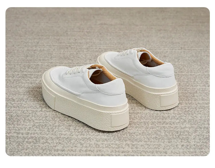 Women's black platform casual sports shoes with embossed cowhide leather upper and round toe design