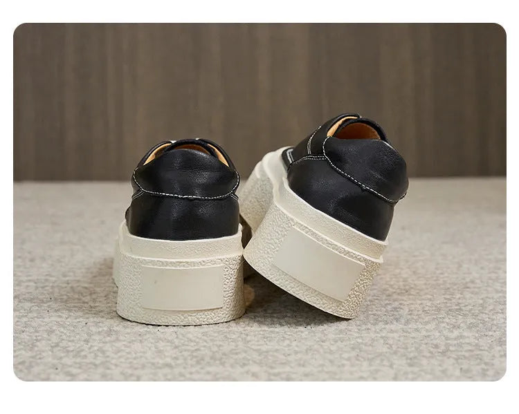 Women's black platform casual sports shoes with embossed cowhide leather upper and round toe design