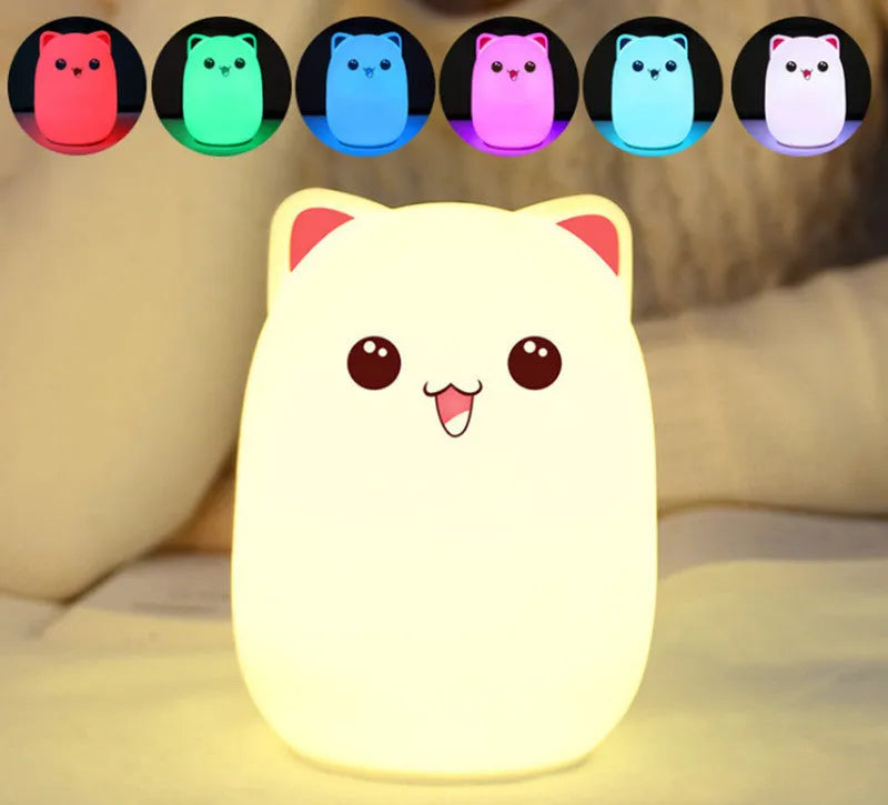 Cartoon silicone clapping lamp in Princess Bear style showing warm white light on a wooden table