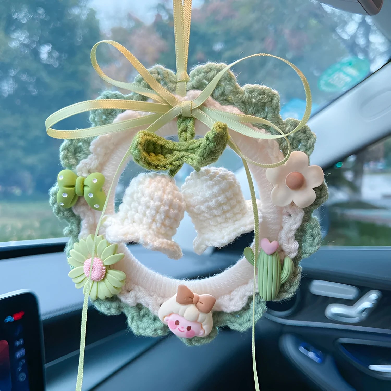 Handwoven wool bell orchid car pendant in green, available with an attached dream catcher.
