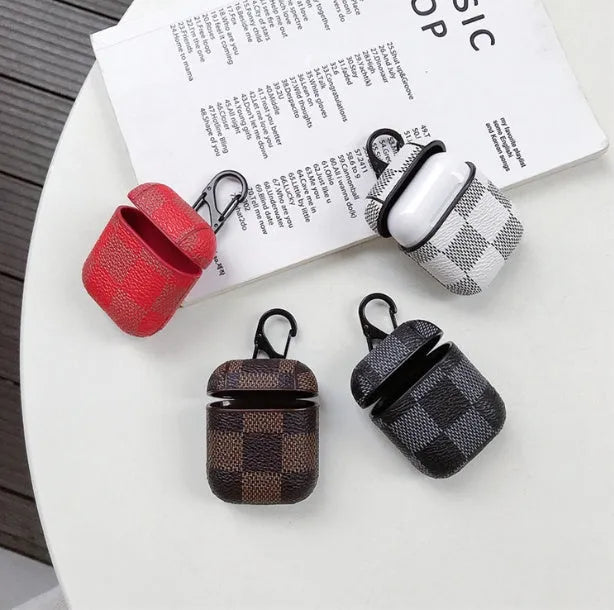 Black lattice hard shell case for iPhone XS Max and AirPods with anti-lost hook attached.