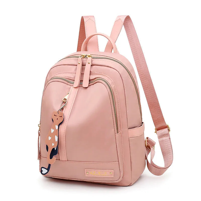 Women's black casual nylon backpack with double shoulder straps showing interior organisation compartments