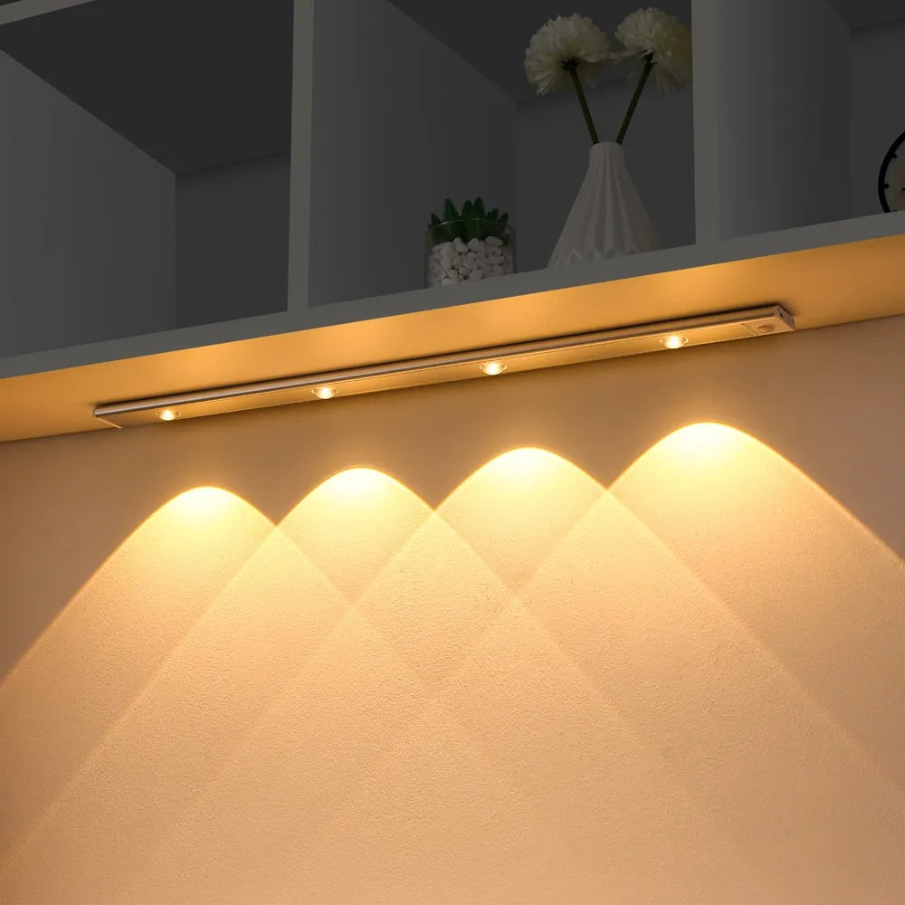 Silver ultra-thin LED light strip with motion sensor mounted inside a wooden wardrobe.