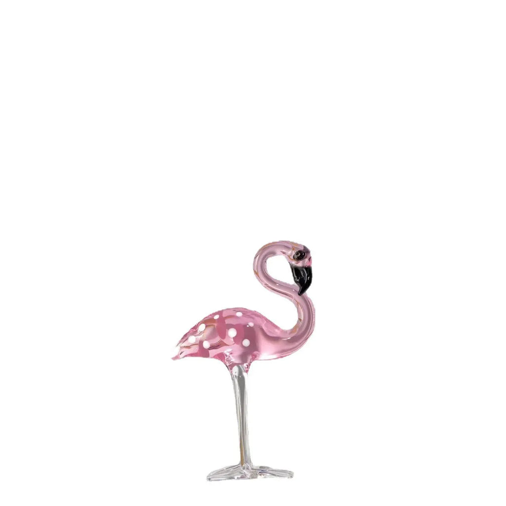 Pink crystal flamingo decorative sculpture on a table, modern simple style.