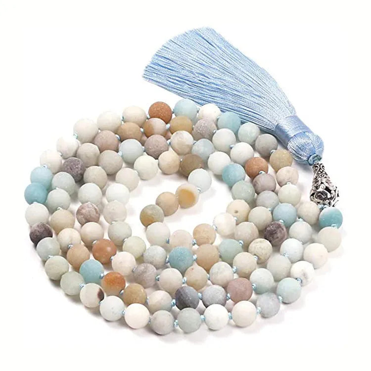 Long geometric agate tassel necklace showing colour options like Indian agate and lapis lazuli on a model.