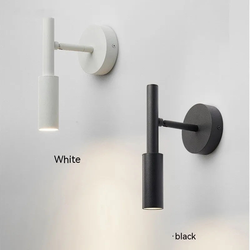 Modern wrought iron wall lamp in black or white finish, showing three colour light options.