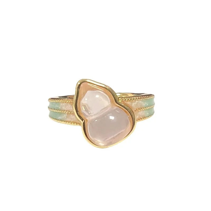 Adjustable vintage-style copper ring with gourd, flower, and bow design featuring inlaid zircon stones.