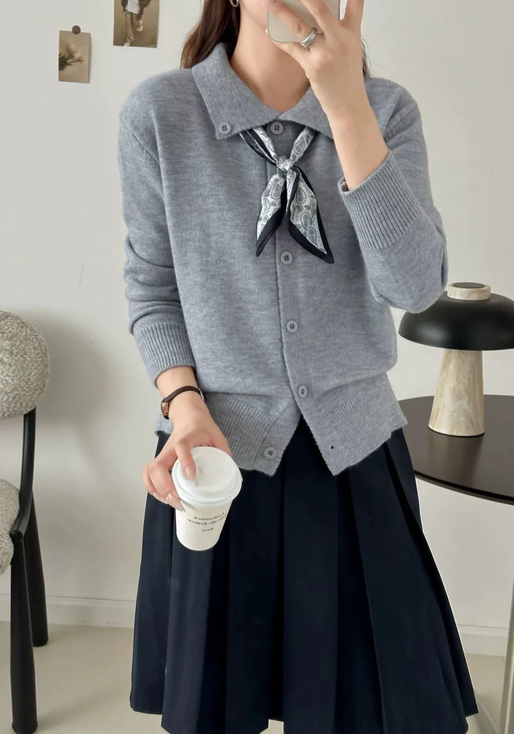 Beige lapel scarf collar cardigan sweater with long sleeves on a hanger
