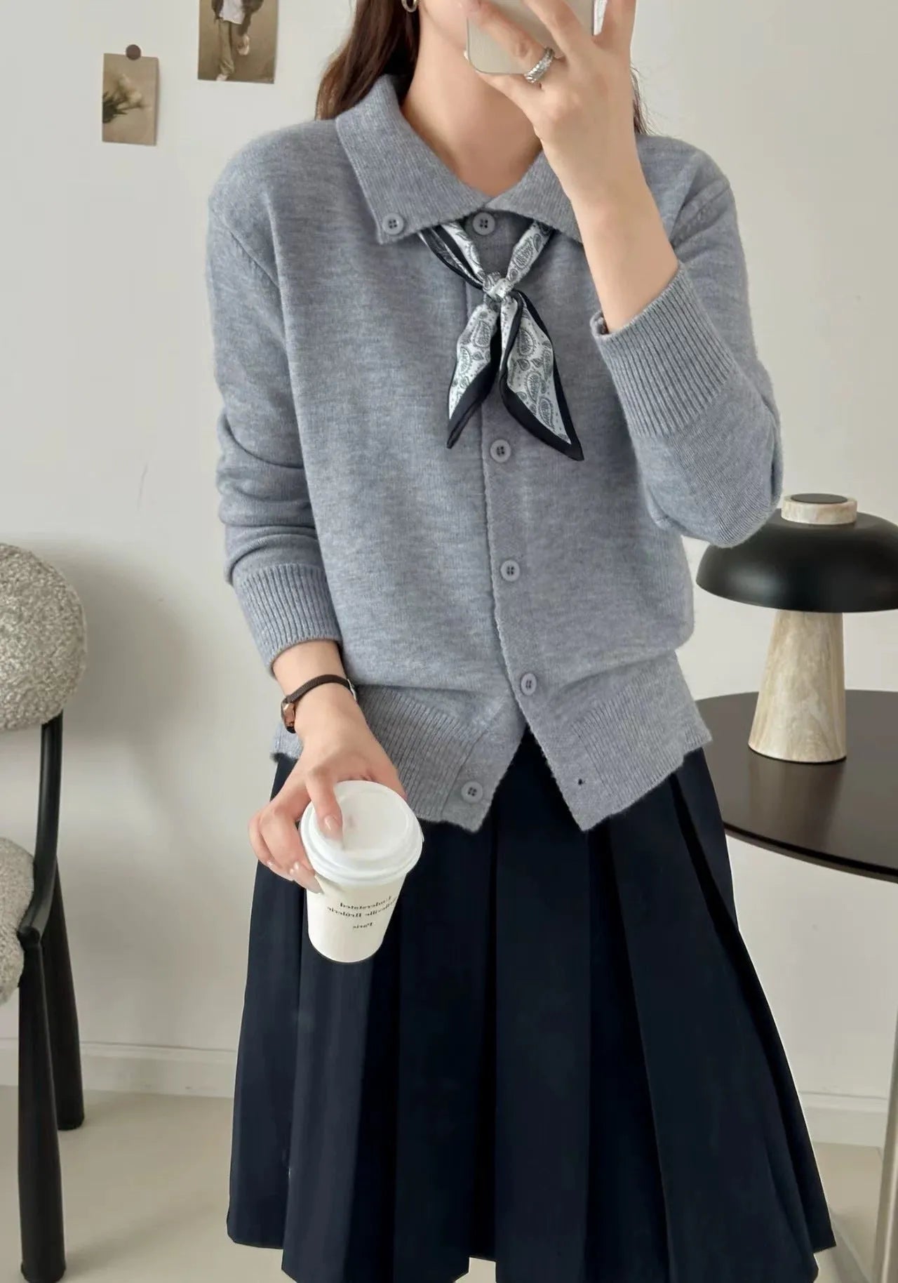 Beige lapel scarf collar cardigan sweater with long sleeves on a hanger