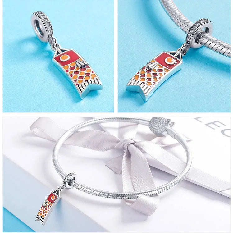 S925 sterling silver carp streamer pendant with zircon stones, measuring 2.8cm.