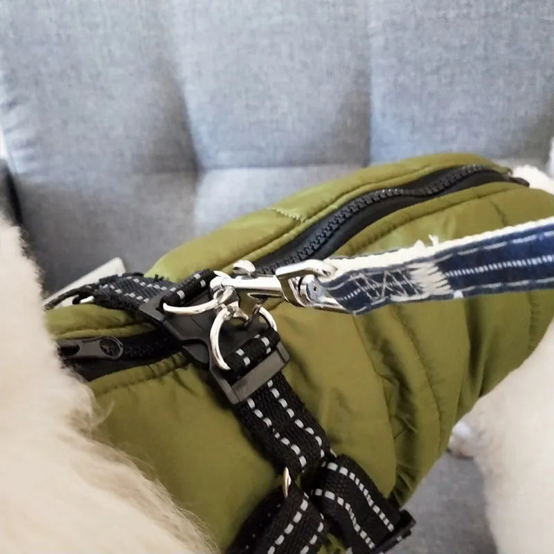 Waterproof dog coat with integrated harness in red, navy blue, or army green, shown on a dog.