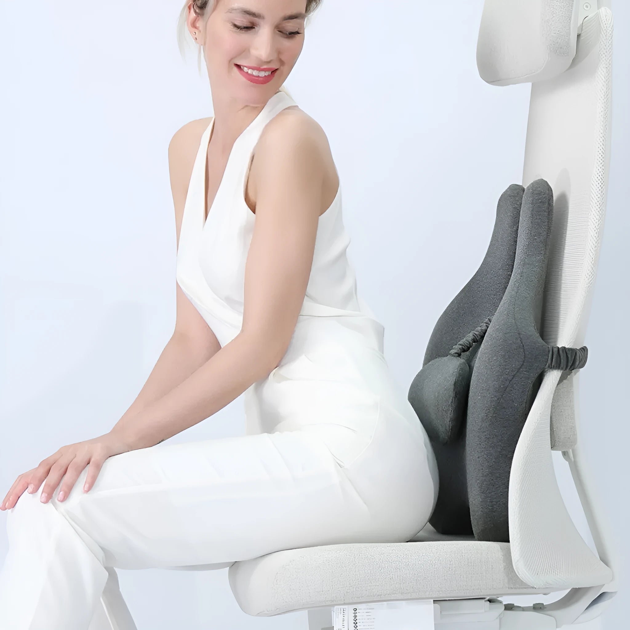 Memory foam car lumbar support cushion in solid colour on a car seat.