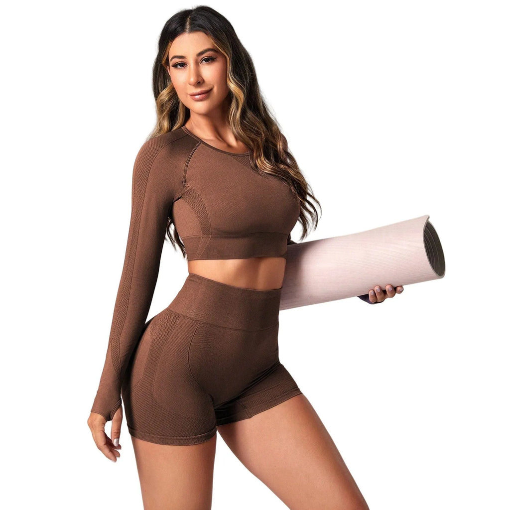 Women's black high waist yoga suit with long sleeves and matching pants