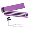 Three fabric resistance bands in lake blue, pink, and purple with mesh carry bag for fitness training