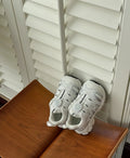 Lightweight beige casual shoes with a breathable PU leather mesh upper for girls and women.