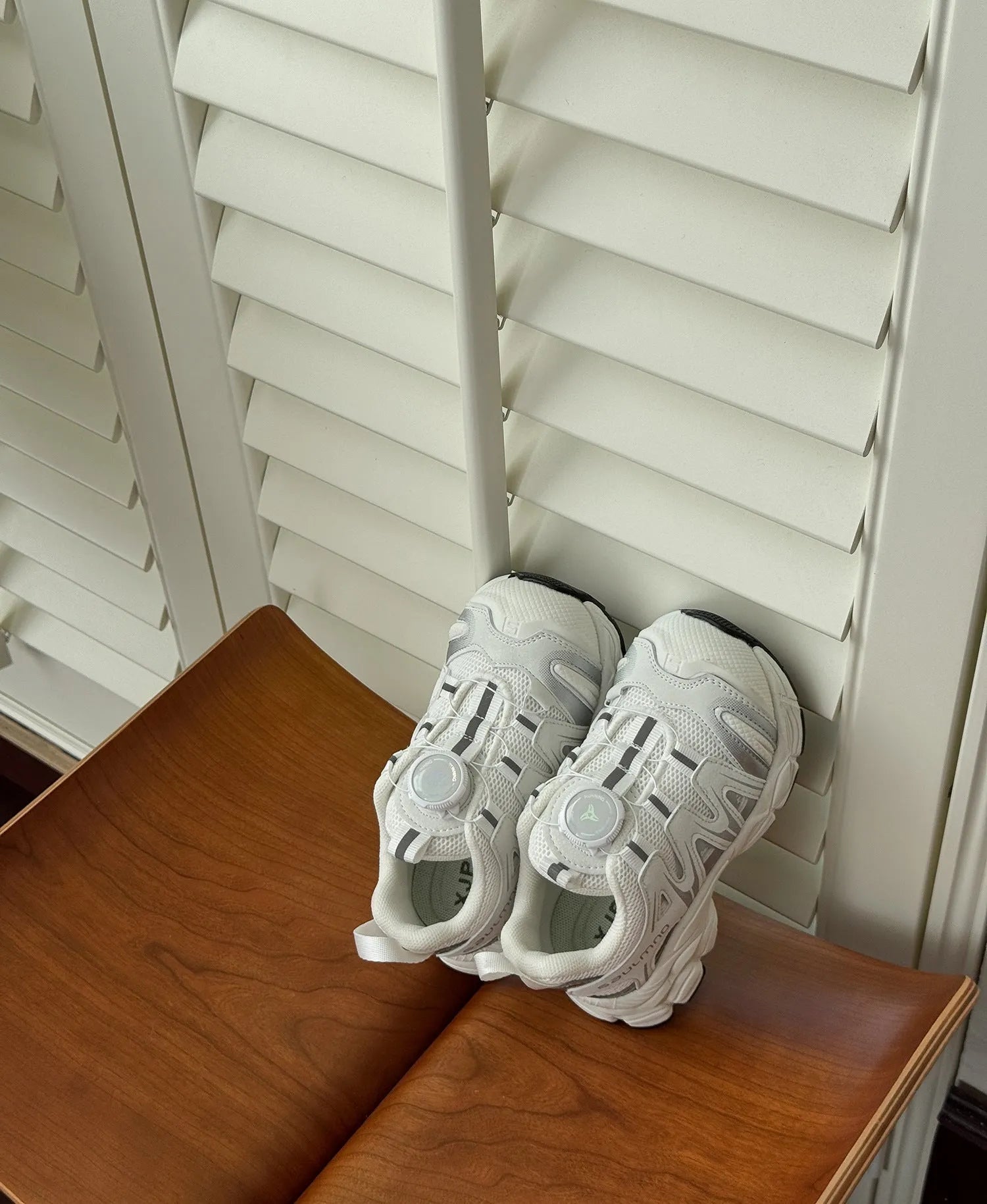 Lightweight beige casual shoes with a breathable PU leather mesh upper for girls and women.