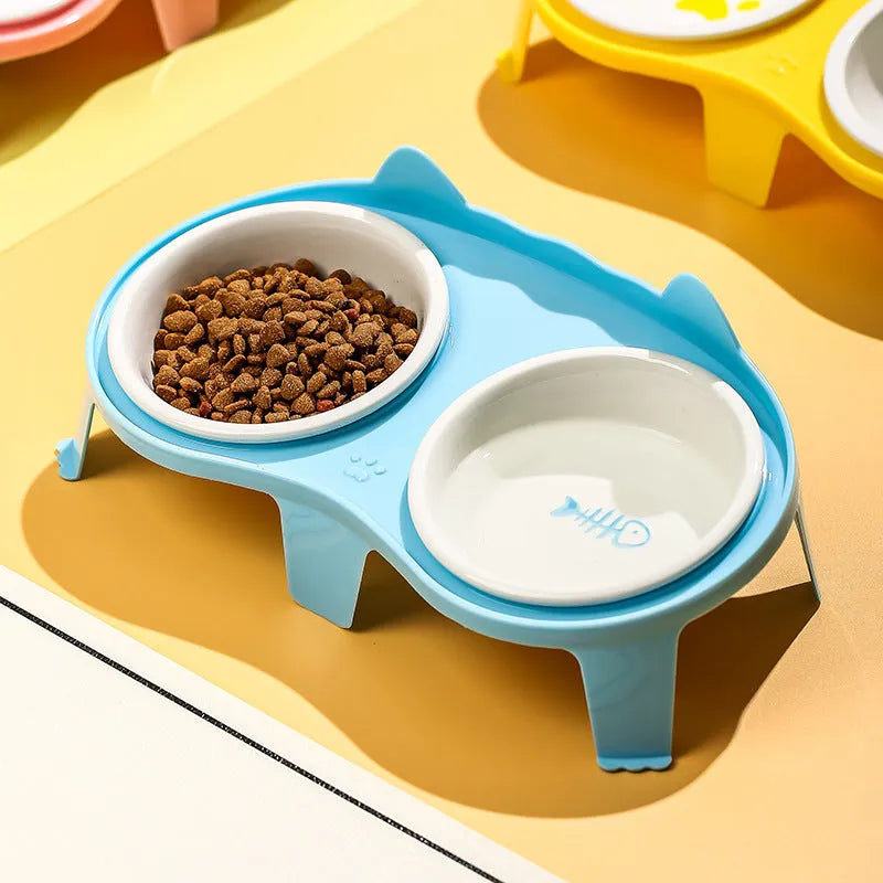 Ceramic cat food and water bowl set with elevated tilted stand in blue, pink, white, or yellow