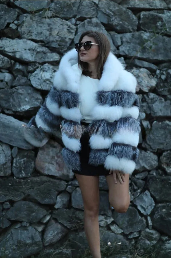 Loose fit women's hooded coat in artificial fur, shown in brown colour, street fashion style.