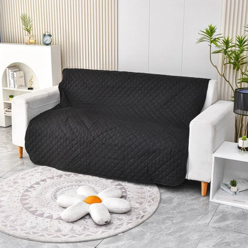 Waterproof reversible dog blanket on a sofa, showing two colour sides, with size chart for nine options.
