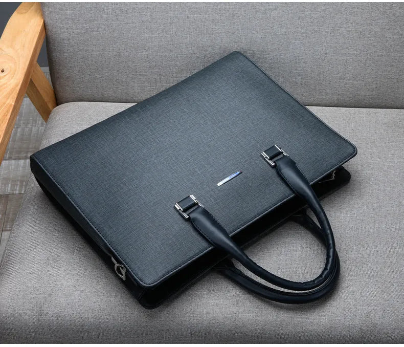 One-shoulder cross-slung male business briefcase in blue with stitching detail and soft handle