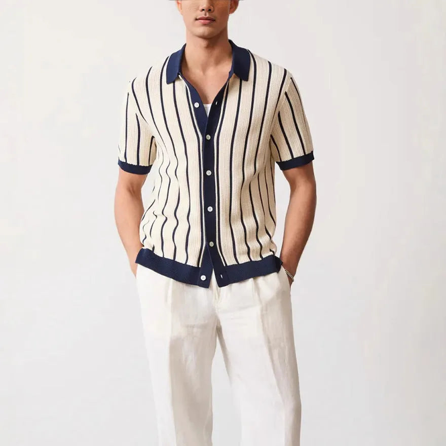 Men's white asymmetric lapel knitted short sleeve top laid flat.