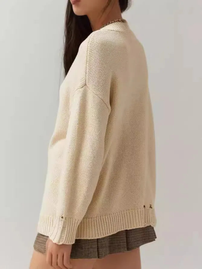 Women's milky white acrylic round neck sweater with loose fit and Jacquard detailing