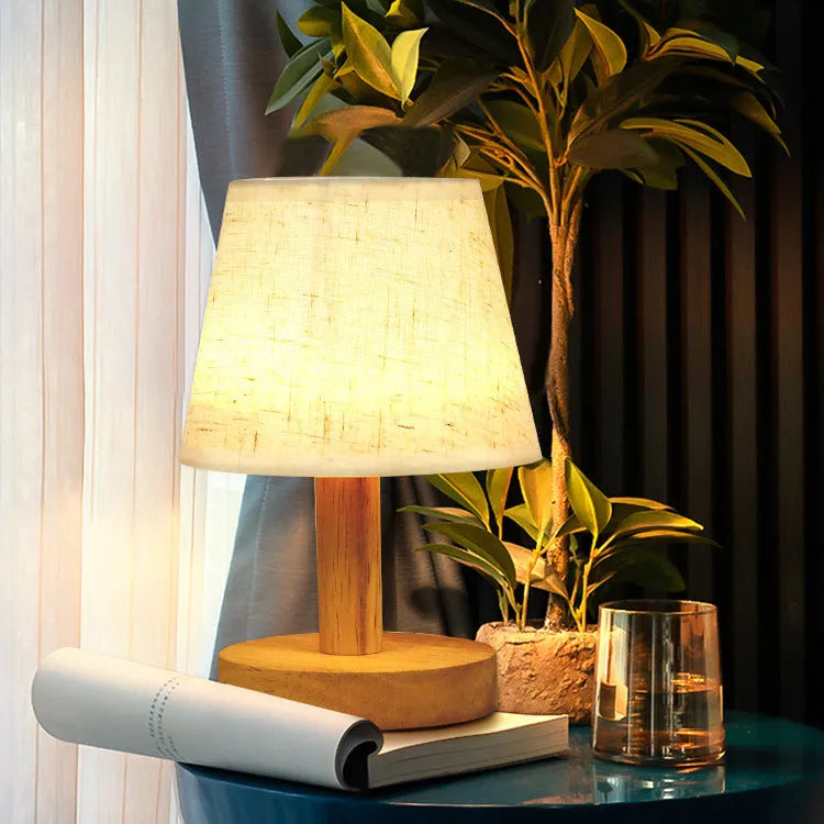 Vintage pleated table lamp with linen shade, jute trim, and bamboo holder showing three-colour dimming function