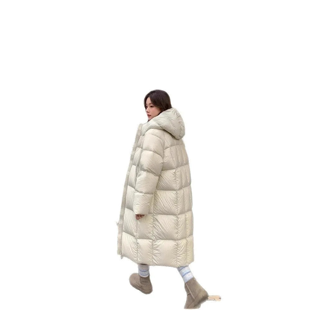 Women's mid-length loose padded puffer coat in beige with white duck down filler and pocket