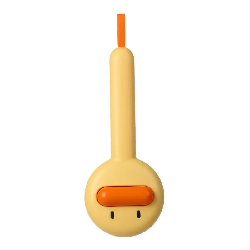 Small plastic pet comb with yellow duck design, showing open sections and floating needles for cat and dog grooming.