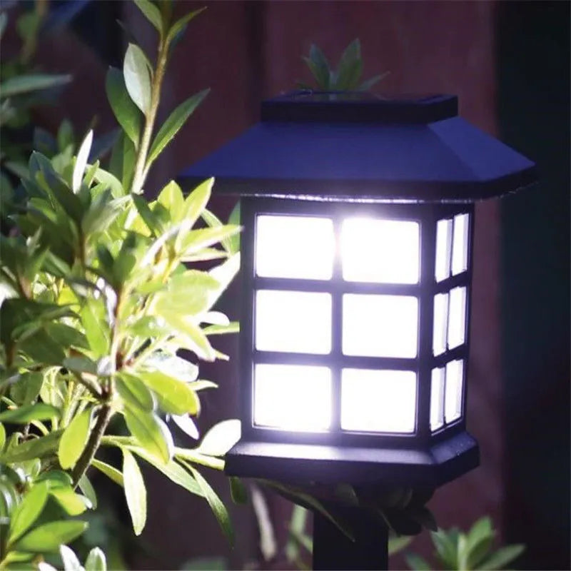 Solar square lawn light with LED, IP44, in a garden setting showing white light illumination