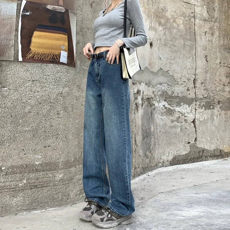 Women's high waist straight leg jeans in a retro blue wash, showcasing the denim fabric and cut.