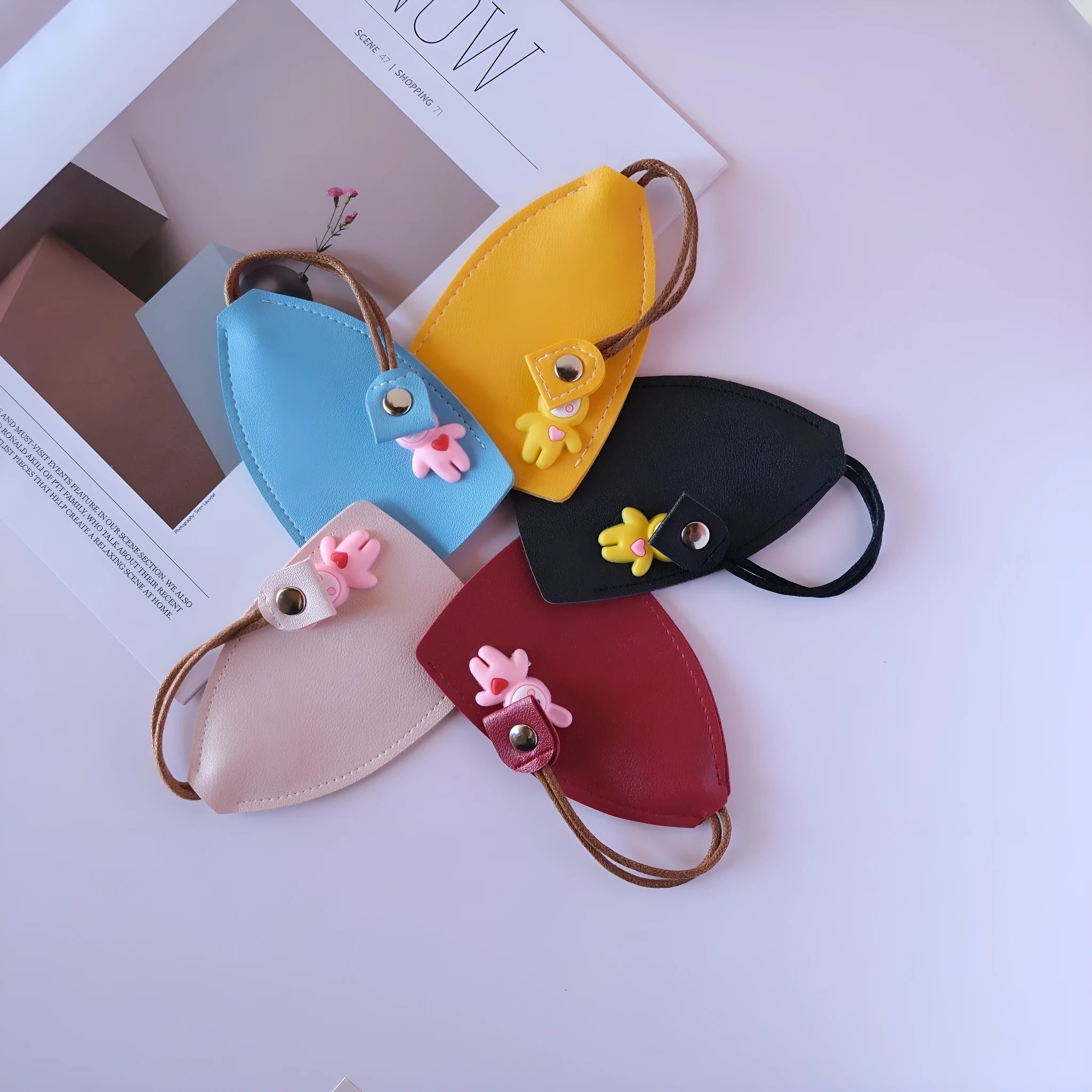 Universal large capacity car key case in PU leather, shown in various colours.