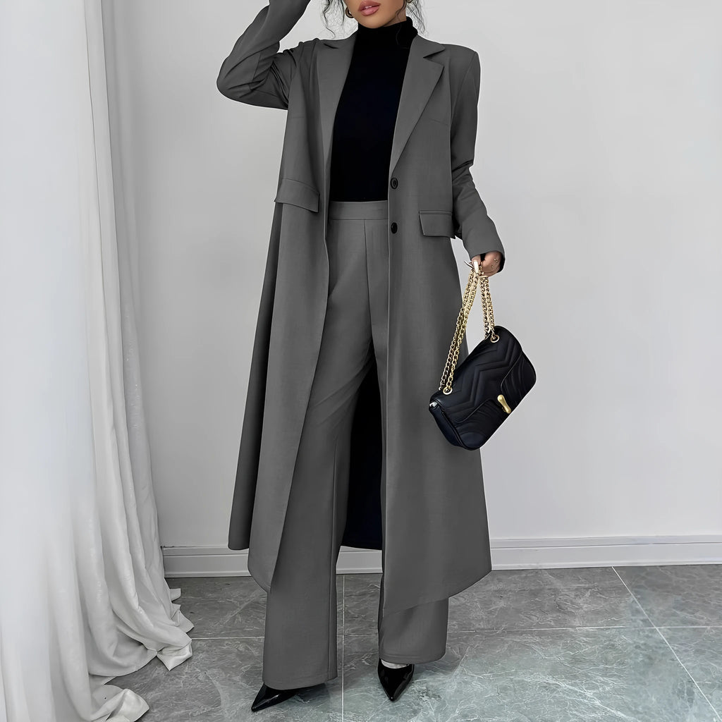 Women's gray polyester two-piece suit with long jacket and trousers on mannequin