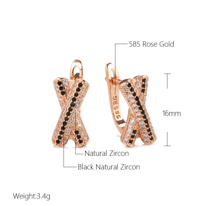 Pair of rose gold copper earrings with hollow-out X-shaped geometric design on light background