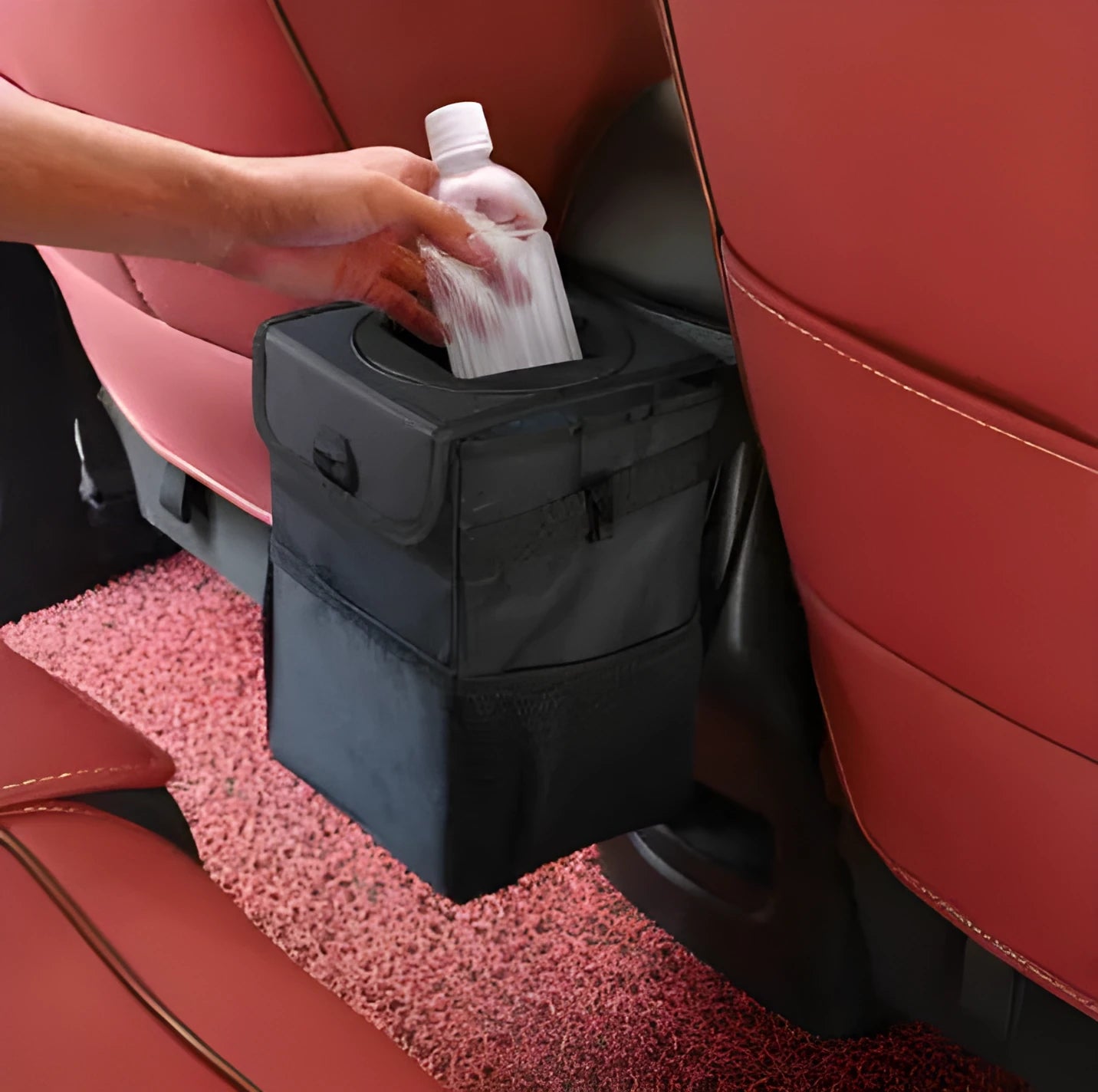 Black Oxford cloth car trash can with hanging strap, mesh pockets, and Velcro lid