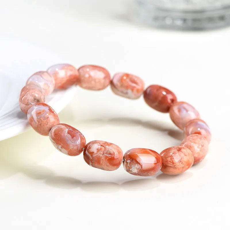 Natural cherry agate bracelet with barrel-shaped beads and Ruyi design element