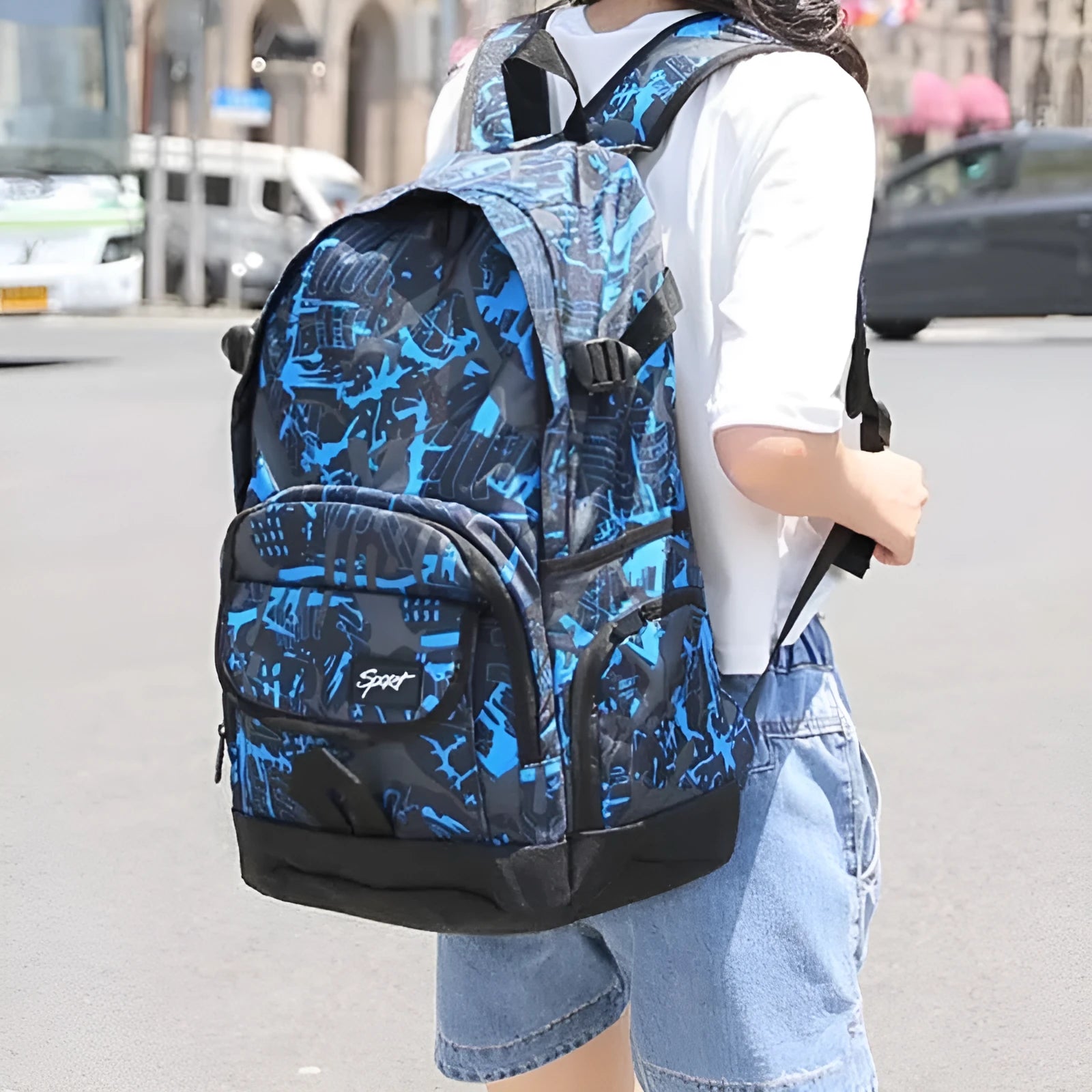 Classic blue nylon backpack with large main compartment, shown front view.