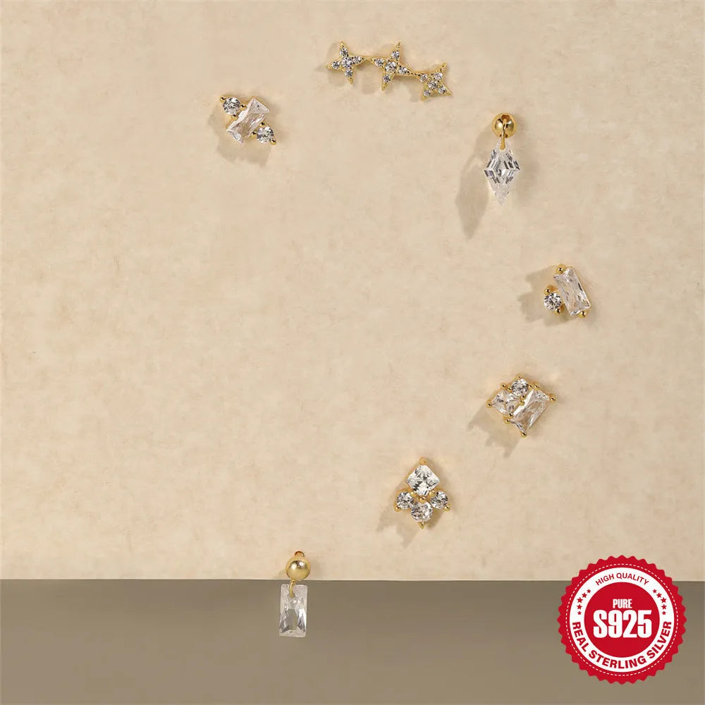S925 sterling silver flower stud earrings with a square red gravel gemstone in a golden electroplated finish.